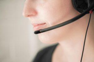 Woman speaking on headset.