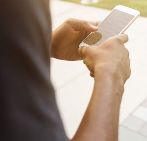 Man using phone for web chat.